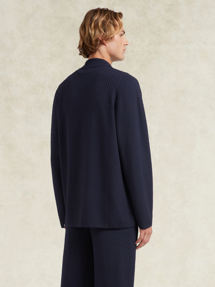 CHÉ Garcia Knitted Blazer Navy - Three-quarter angle showcasing the blazer's versatile styling and navy color depth