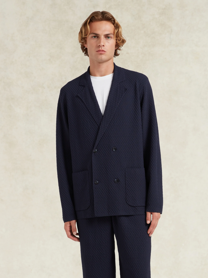 CHÉ Garcia Knitted Blazer Navy - Full styling shot demonstrating the blazer's professional appearance and knitted fabric drape