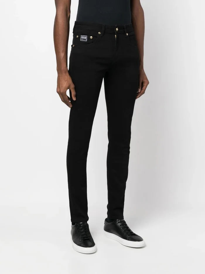 VERSACE MEN Gold Logo Patch Denim Jeans Black - MAISONDEFASHION.COM