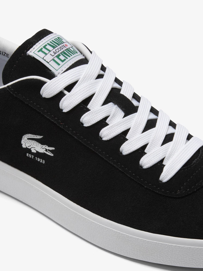 LACOSTE Baseshot Leather Sneakers in Black/White - close-up detail of embroidered crocodile logo and premium leather texture