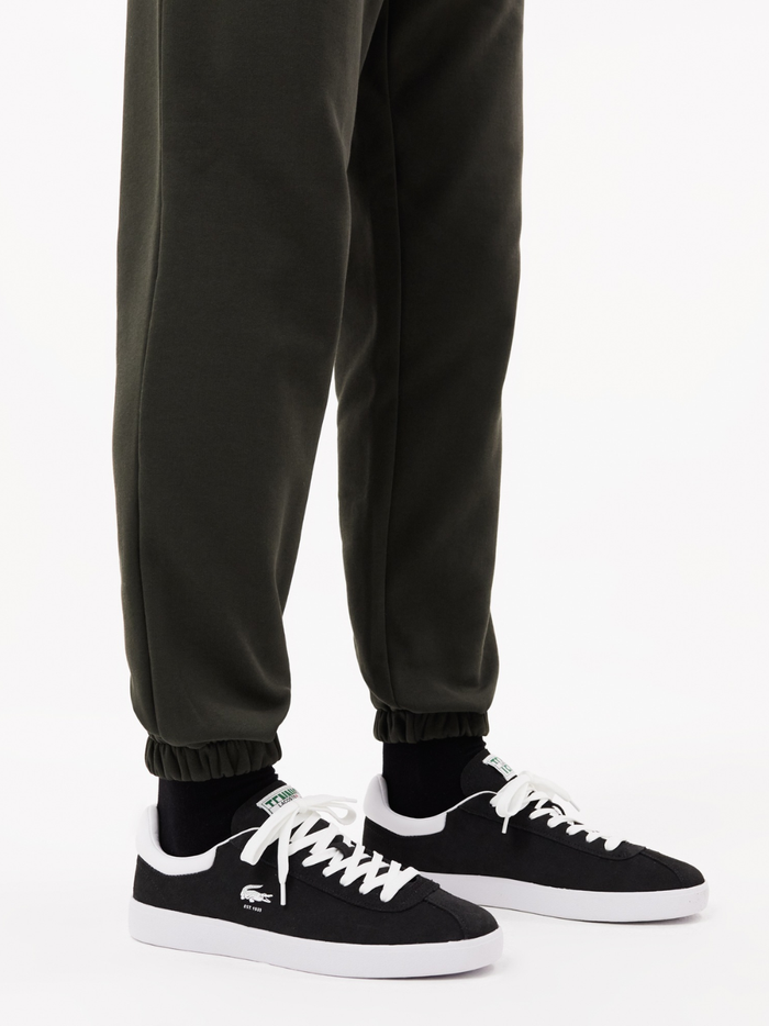 LACOSTE Baseshot Leather Sneakers in Black/White - lifestyle shot or additional angle showcasing versatile black and white colorway