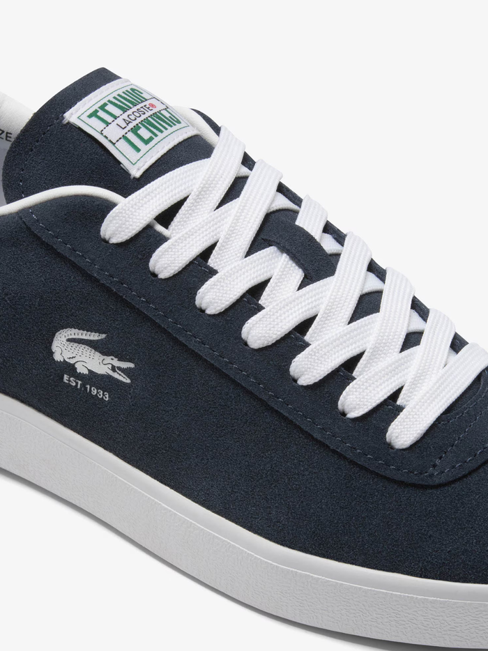LACOSTE Baseshot Leather Sneakers in Navy/White - close-up detail of embroidered crocodile logo and premium leather texture