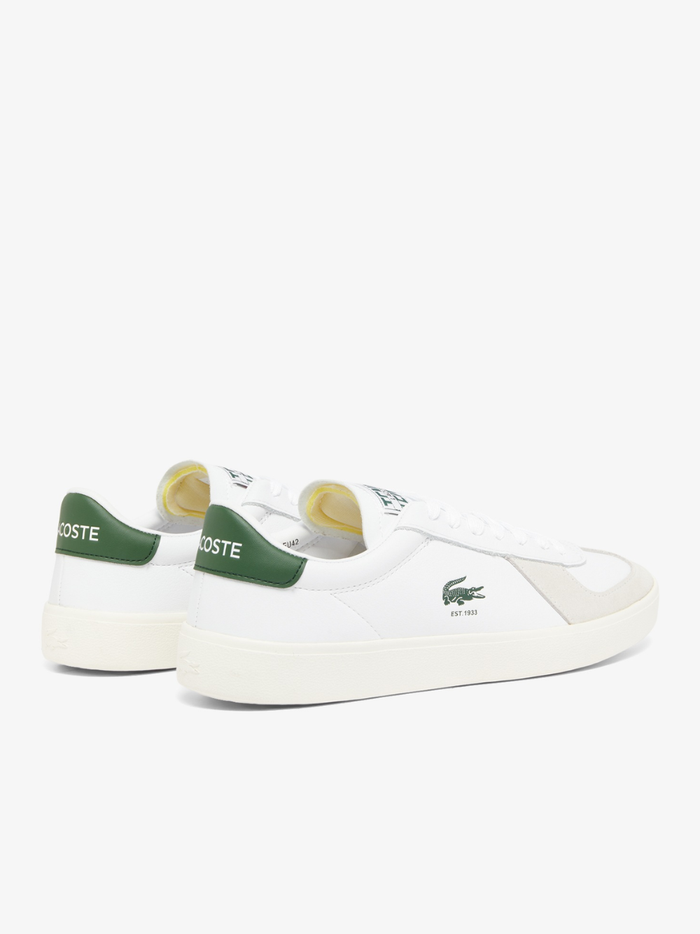 Outsole view of LACOSTE Baseshot Pro sneakers displaying gum rubber sole with textured tread pattern and LACOSTE branding