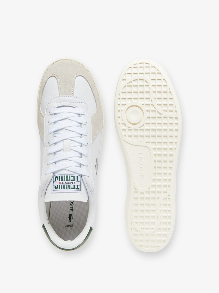 Front view of LACOSTE Baseshot Pro white leather sneakers showing rounded toe box, minimalist design, and premium leather construction