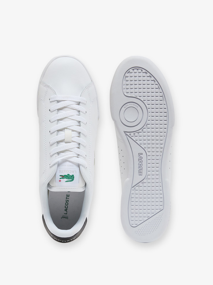 Outsole view of LACOSTE Carnaby Cup sneakers displaying gum rubber sole with textured tread pattern and LACOSTE branding