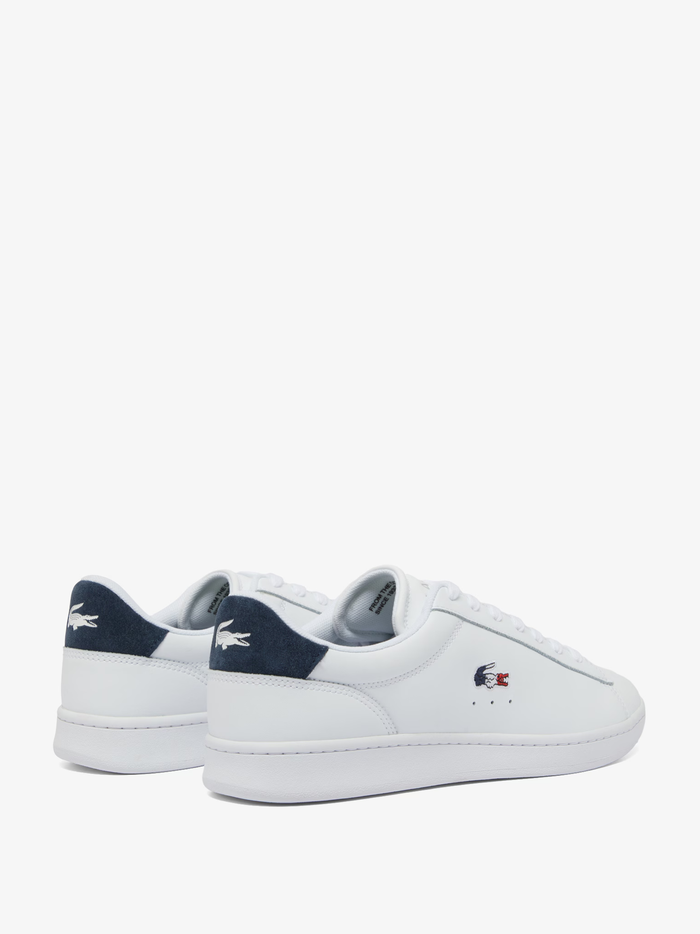 LACOSTE Carnaby Set sneakers back view showing navy blue heel counter with red and white LACOSTE branding