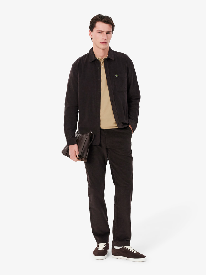 LACOSTE Classic Fit L.12.12 Original Polo Shirt in Beige - Side Profile Displaying Ribbed Collar and Sleeve Hems