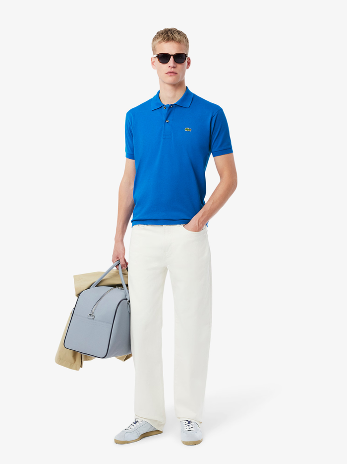 LACOSTE Classic Fit L.12.12 Original Polo Shirt in Denim Blue - close-up detail of embroidered crocodile logo and button placket