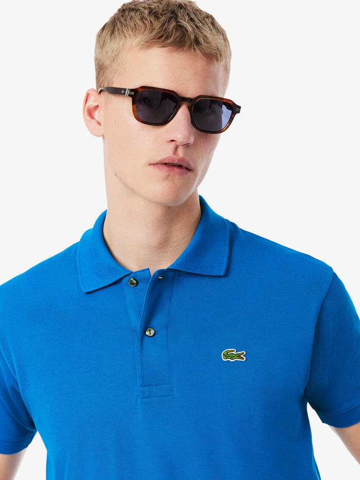 LACOSTE Classic Fit L.12.12 Original Polo Shirt in Denim Blue - side view showing classic fit and sleeve length