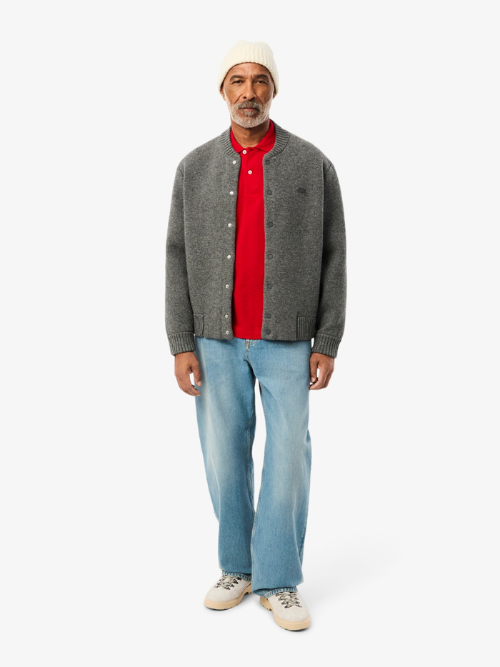 LACOSTE Classic Fit L.12.12 Original Polo Shirt in Red - Side Profile Displaying Ribbed Collar and Sleeve Hems