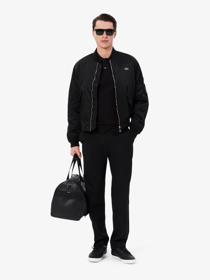 LACOSTE Classic Fit Long Sleeved L.12.12 Polo Shirt in Black - Side Detail View