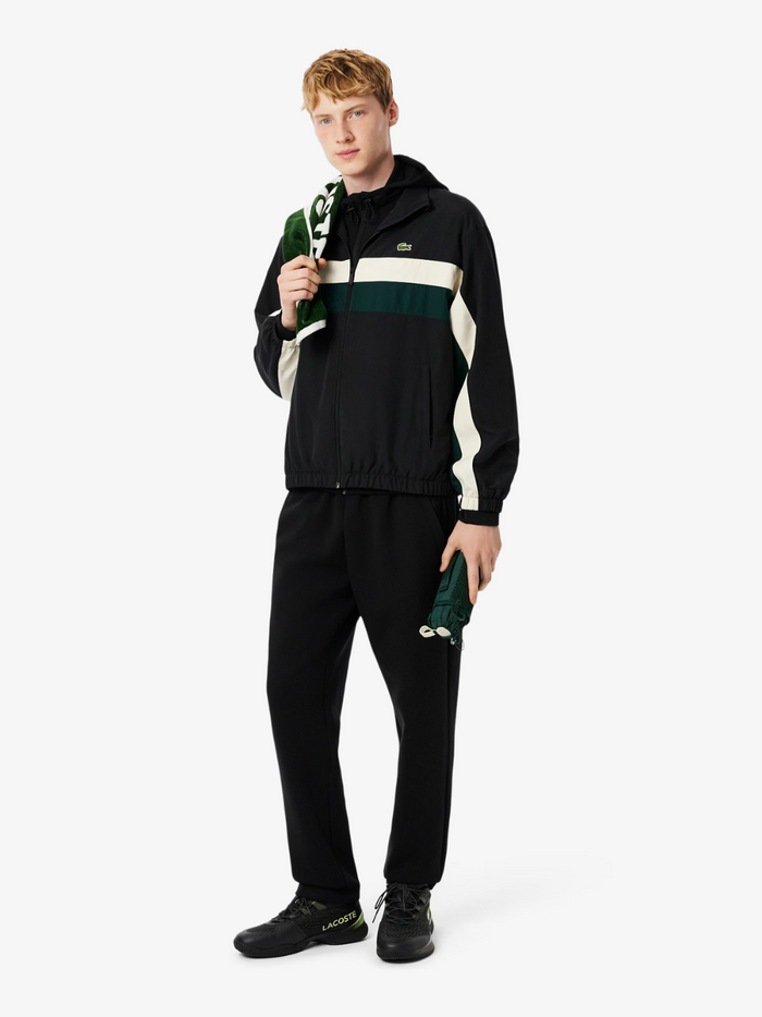 LACOSTE Water-Repellent Track Jacket Black - side profile view showing the jacket's fit and colour-block construction