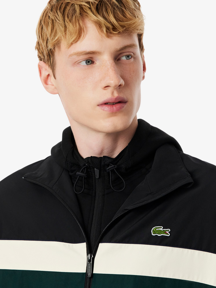 LACOSTE Black Track Jacket - close-up detail of colour-block design, water-repellent fabric and premium craftsmanship