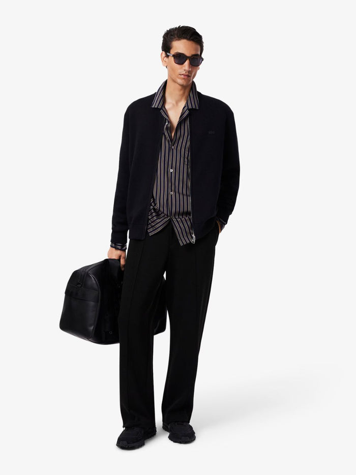LACOSTE Cotton and Wool Knit Bomber Jacket - side profile view showcasing relaxed fit and premium knit construction in Black