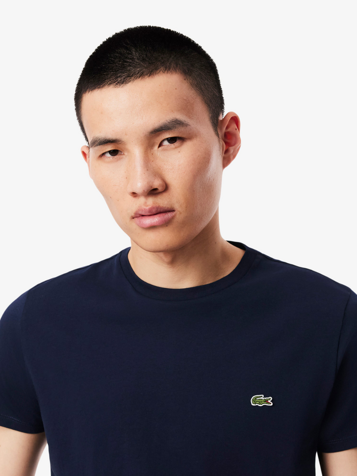 LACOSTE Cotton Pima T-shirt Midnight Blue - close-up detail of the embroidered crocodile logo and fabric texture