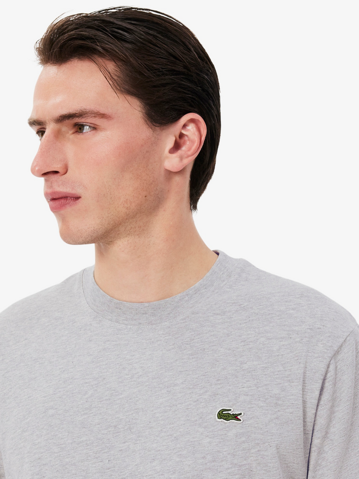 LACOSTE grey cotton t-shirt side profile view showing relaxed fit and sleeve detail