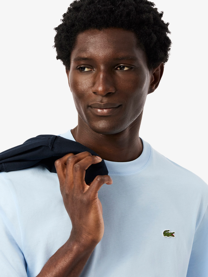LACOSTE Cotton T-shirt Light Blue - close-up detail of iconic crocodile logo embroidery
