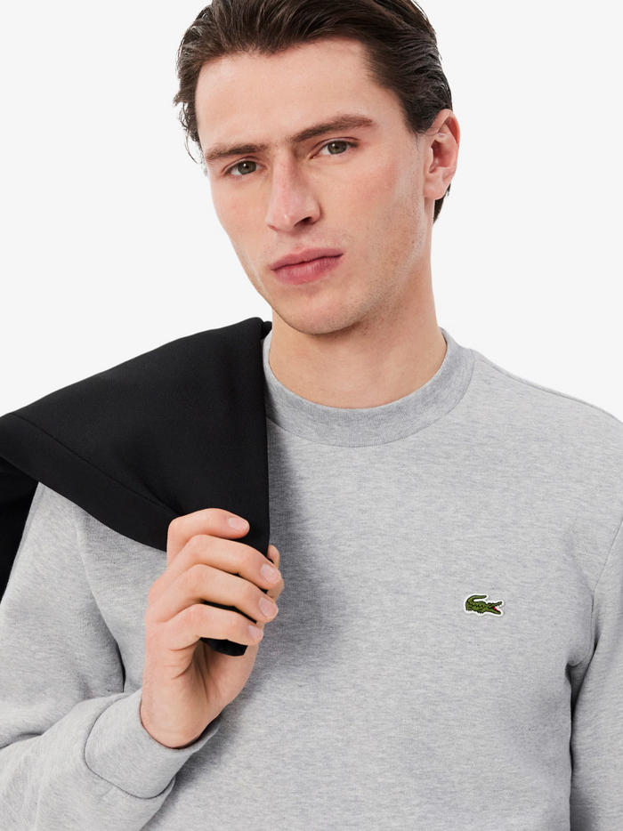 LACOSTE Fleece Crew Neck Sweatshirt Grey - detail shot of the embroidered crocodile logo and fleece material quality