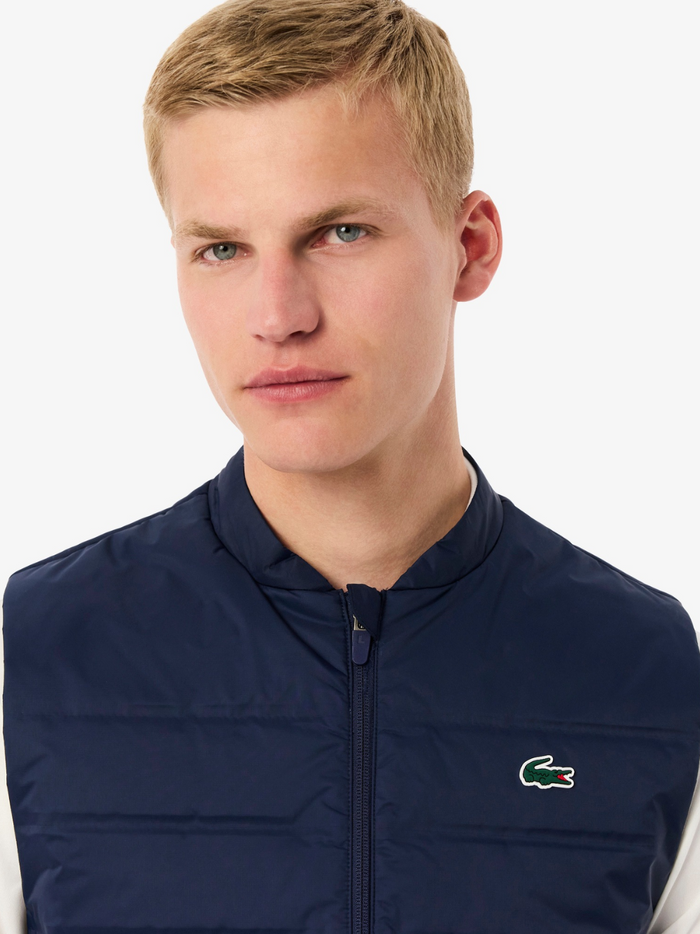 LACOSTE Navy Quilted Golf Vest - close-up detail of quilted fabric texture and premium golf craftsmanship