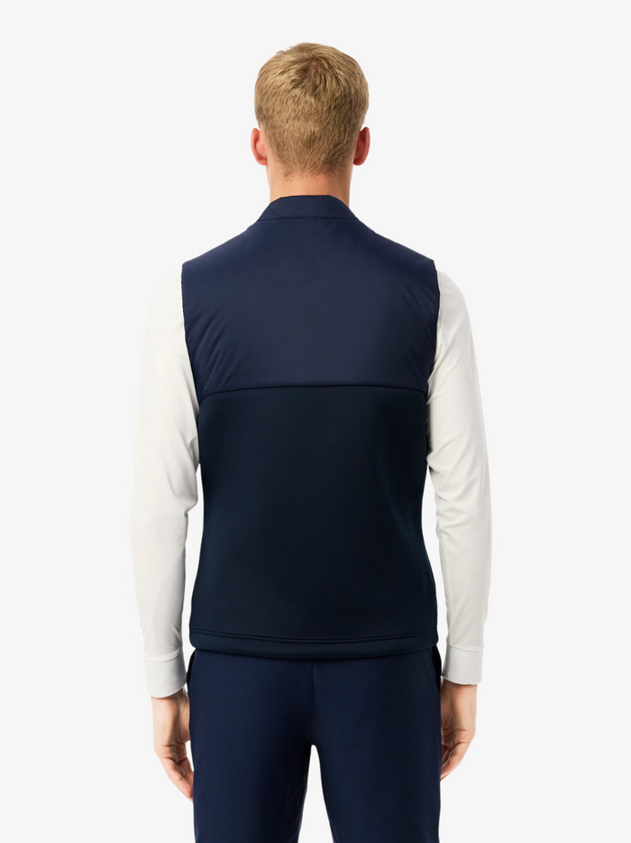 LACOSTE Golf Quilted Vest in Navy - lifestyle shot or alternative angle showcasing the vest's golf performance features