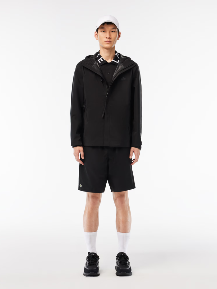 LACOSTE L003 Evo Black Sneakers - Inner Side View Showing Breathable Mesh Construction and Crocodile Logo