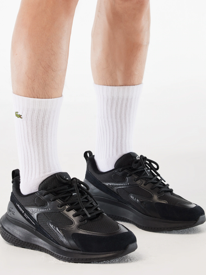 LACOSTE L003 Evo Black Sneakers - Sole View Showing Durable Rubber Outsole with Traction Pattern