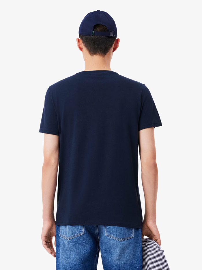 LACOSTE Lightweight V Neck T-shirt - lifestyle shot showing midnight blue colour and versatile styling