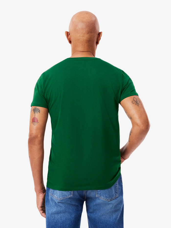 LACOSTE Lightweight V Neck T-shirt - lifestyle shot showing pine green colour and versatile styling