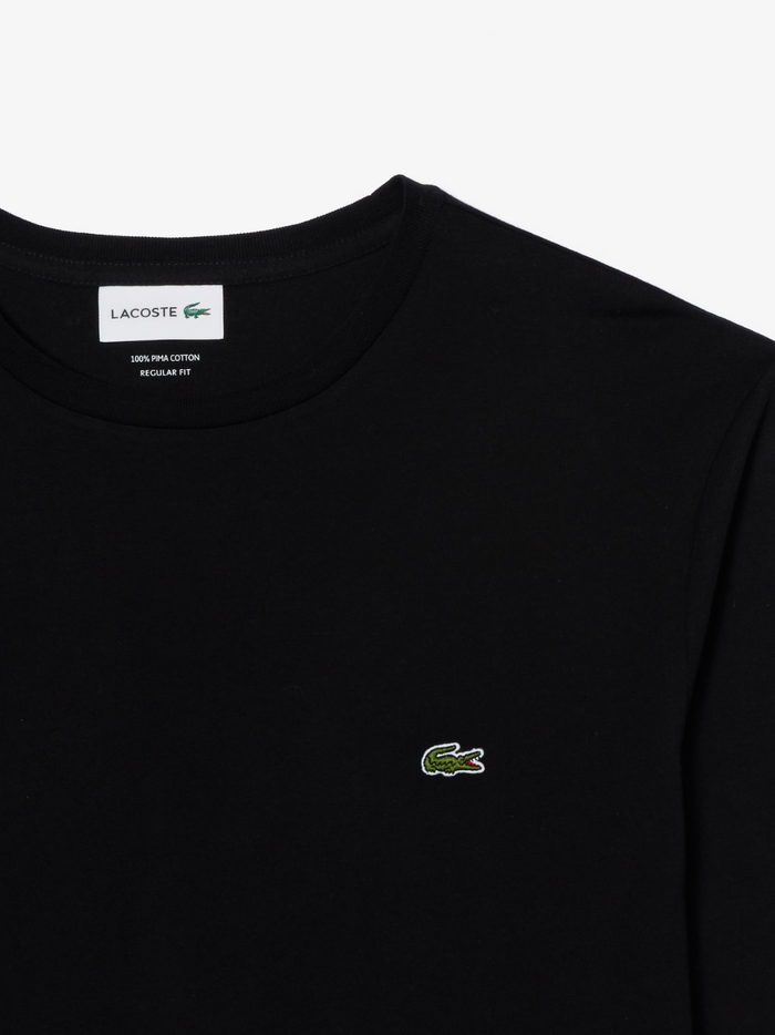 LACOSTE Long Sleeved Cotton Pima T-shirt in Black - lifestyle shot showing the versatile styling and fit