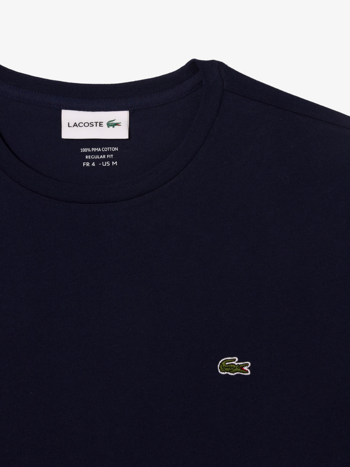 LACOSTE Long Sleeved Cotton Pima T-shirt in Midnight Blue - lifestyle shot showing the versatile styling and fit