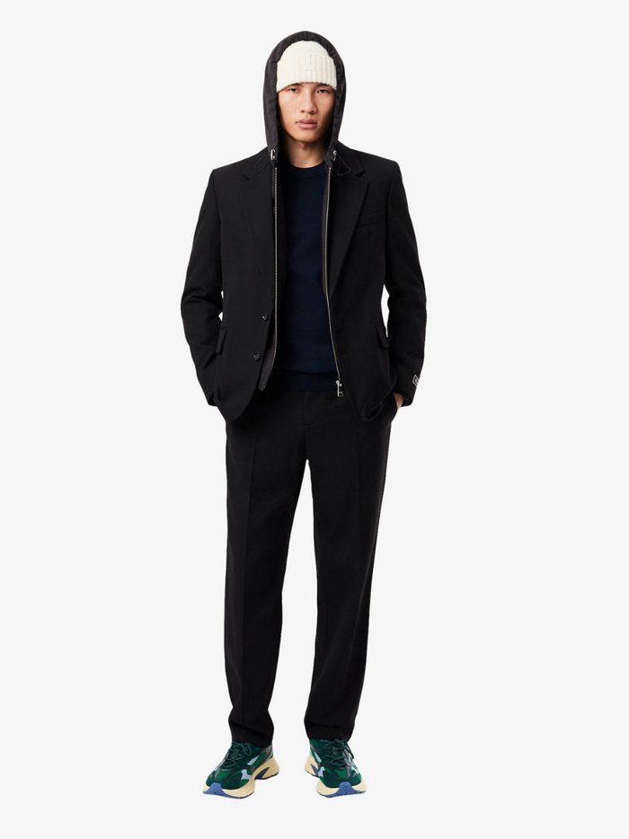 LACOSTE midnight blue monochrome sweater side profile highlighting crew neck collar and relaxed fit silhouette