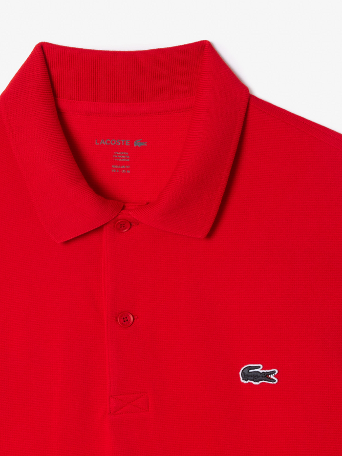 LACOSTE regular fit cotton blend polo shirt in red - styling view demonstrating how the polo shirt looks when worn