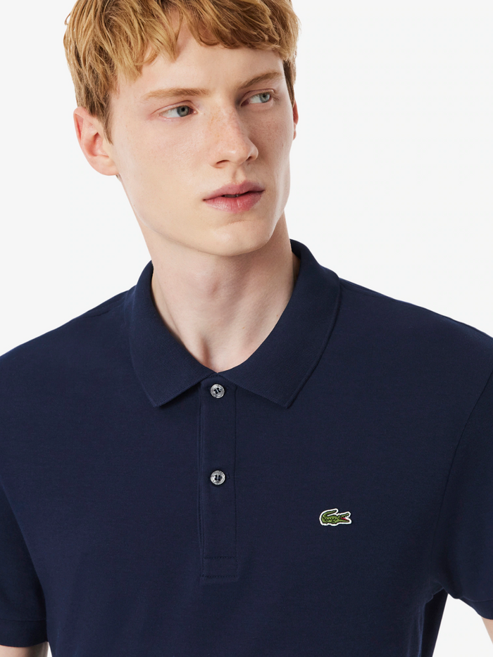 LACOSTE Regular Fit Cotton Pima Polo Shirt in midnight blue - side view highlighting the comfortable regular fit and classic polo design