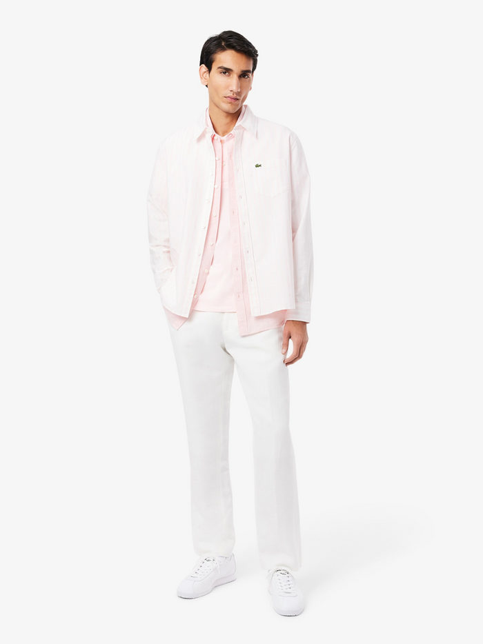 LACOSTE Polo Shirt Pale Pink - Side profile view highlighting the regular fit and luxurious cotton Pima fabric texture
