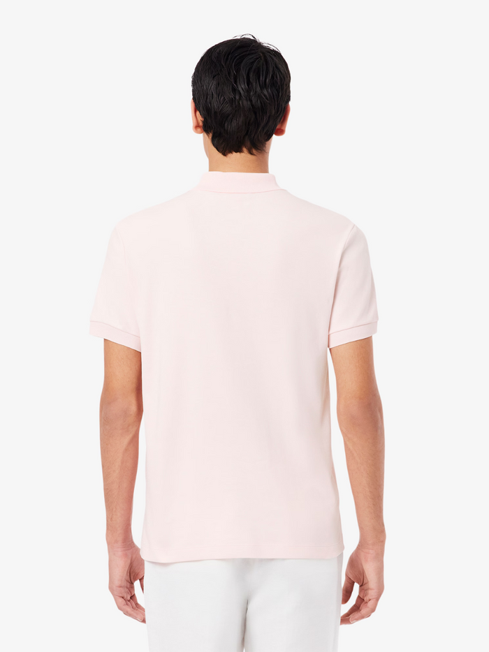 LACOSTE Cotton Pima Polo Shirt - Detail shot of signature crocodile logo embroidered on pale pink premium cotton fabric