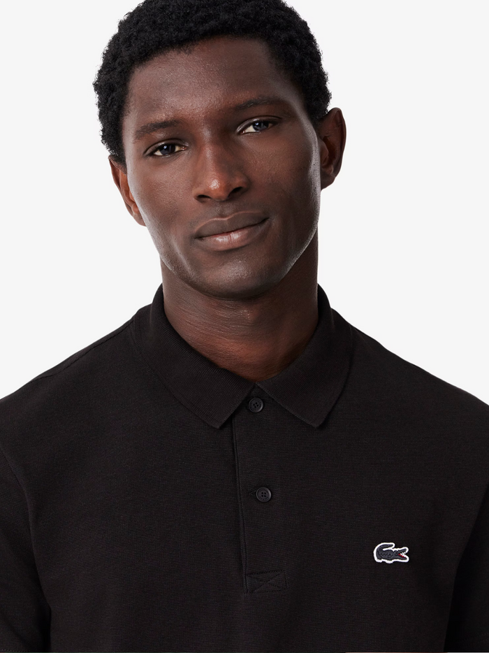LACOSTE Black Polo Shirt - Close-up detail of collar and button placket showing quality construction and craftsmanship