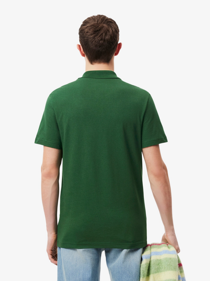 LACOSTE Polo Shirt - Detail shot of signature crocodile logo embroidered on green cotton polyester blend fabric