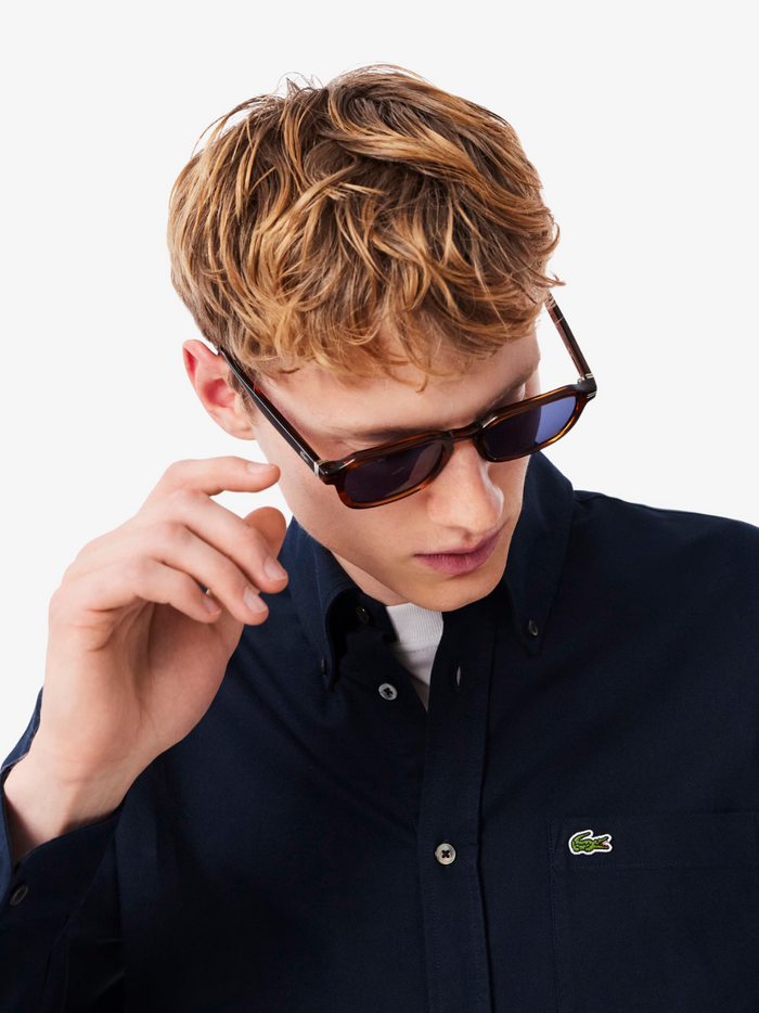 LACOSTE Regular Fit Oxford Shirt in navy blue - side view highlighting the comfortable regular fit and classic sleeve design