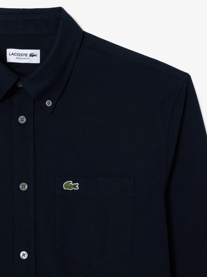 LACOSTE Regular Fit Oxford Shirt in navy blue - styled view showcasing the versatile and timeless navy colour