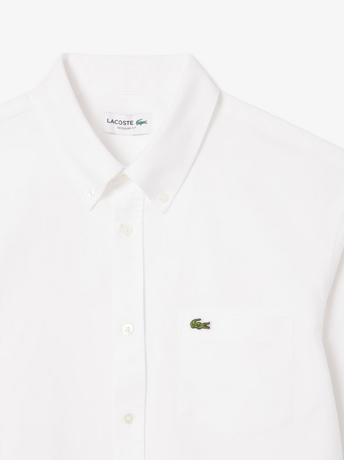LACOSTE Regular Fit Oxford Shirt in white - styled view showcasing the crisp, versatile white colour perfect for any occasion
