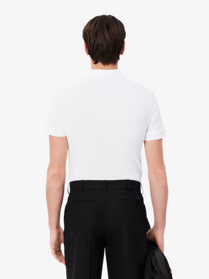 LACOSTE Regular Fit Paris Stretch Piqué Polo Shirt White - lifestyle shot or alternative angle showcasing the crisp white colour