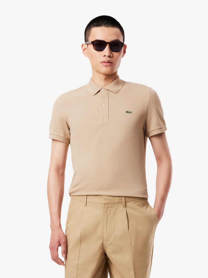 Back view of LACOSTE beige slim fit polo shirt showing classic piqué cotton texture and tailored fit