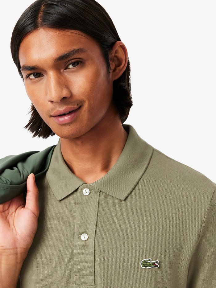 Side profile of LACOSTE L.12.12 khaki green polo shirt highlighting slim fit cut and ribbed collar detail