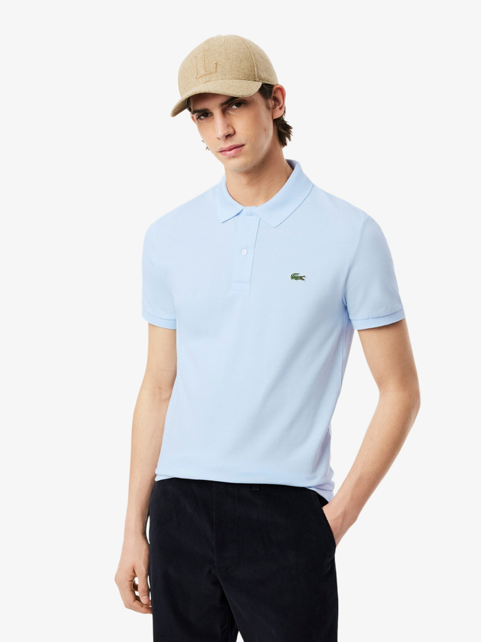 Back view of LACOSTE light blue slim fit polo shirt showing classic piqué cotton texture and tailored fit