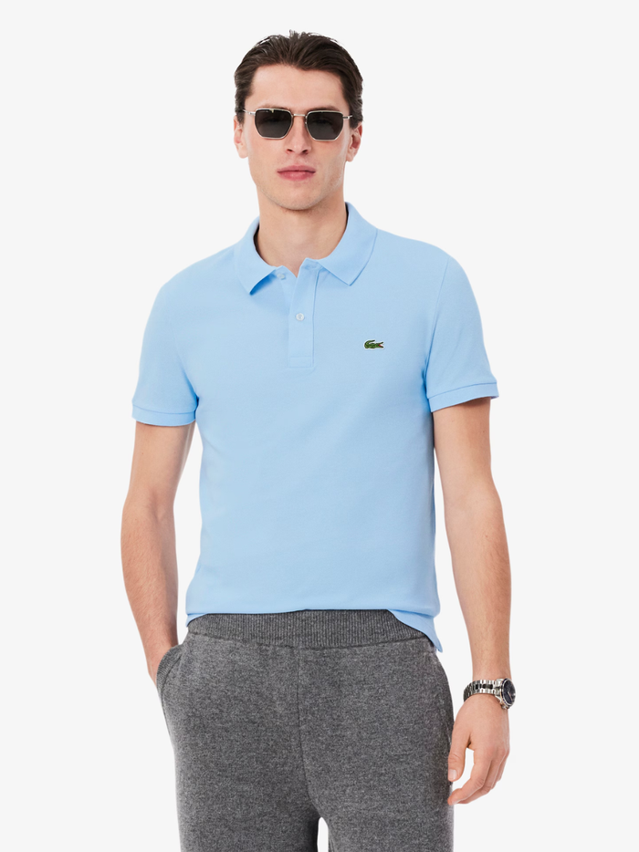 Back view of LACOSTE pale blue slim fit polo shirt showing classic piqué cotton texture and tailored fit