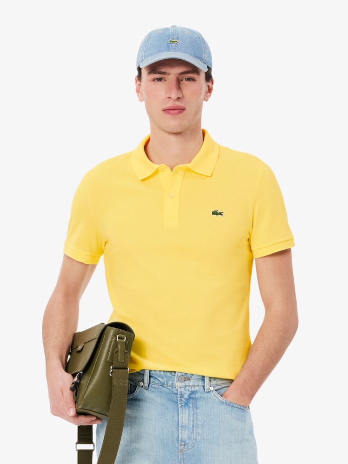 Back view of LACOSTE pastel yellow slim fit polo shirt showing classic piqué cotton texture and tailored fit