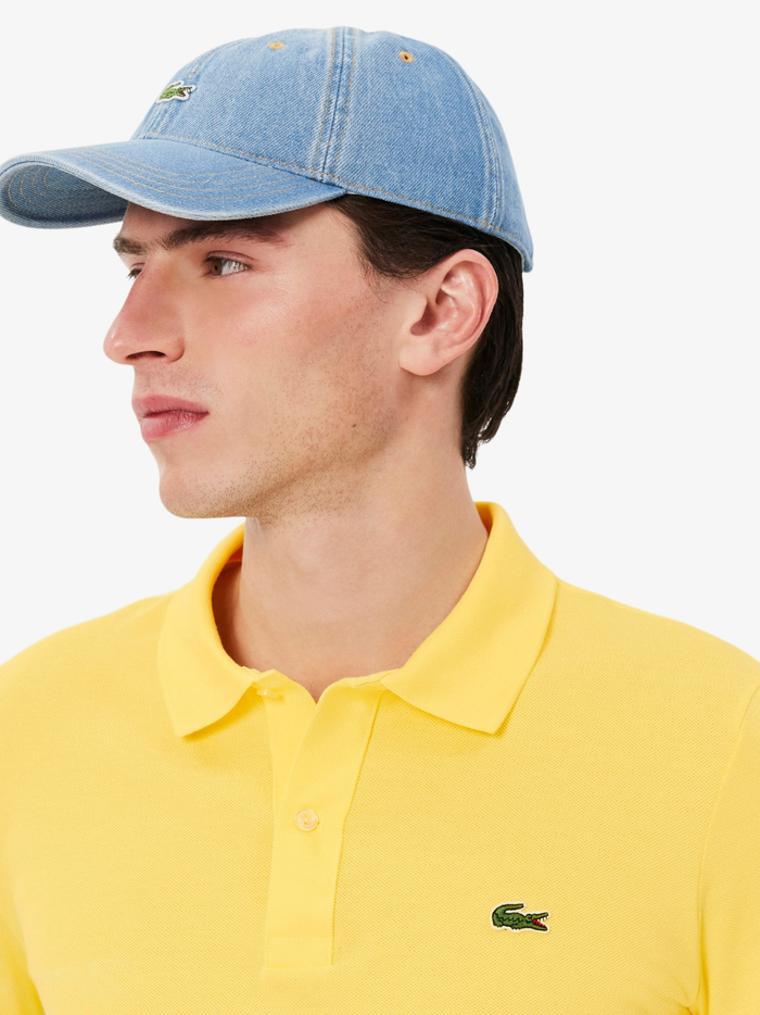 Side profile of LACOSTE L.12.12 pastel yellow polo shirt highlighting slim fit cut and ribbed collar detail