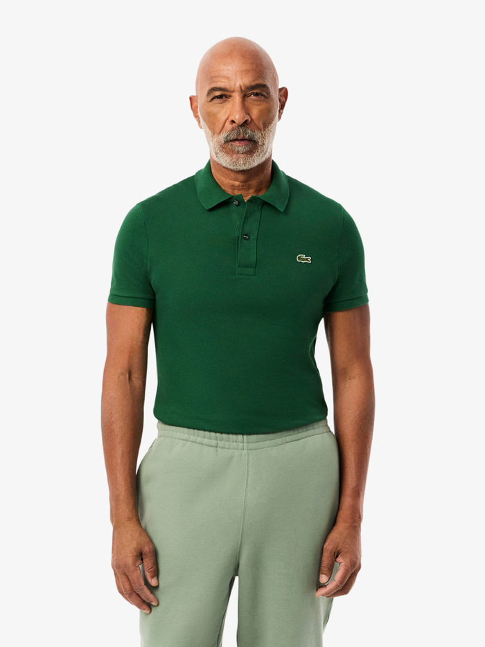 Back view of LACOSTE pine green slim fit polo shirt showing classic piqué cotton texture and tailored fit
