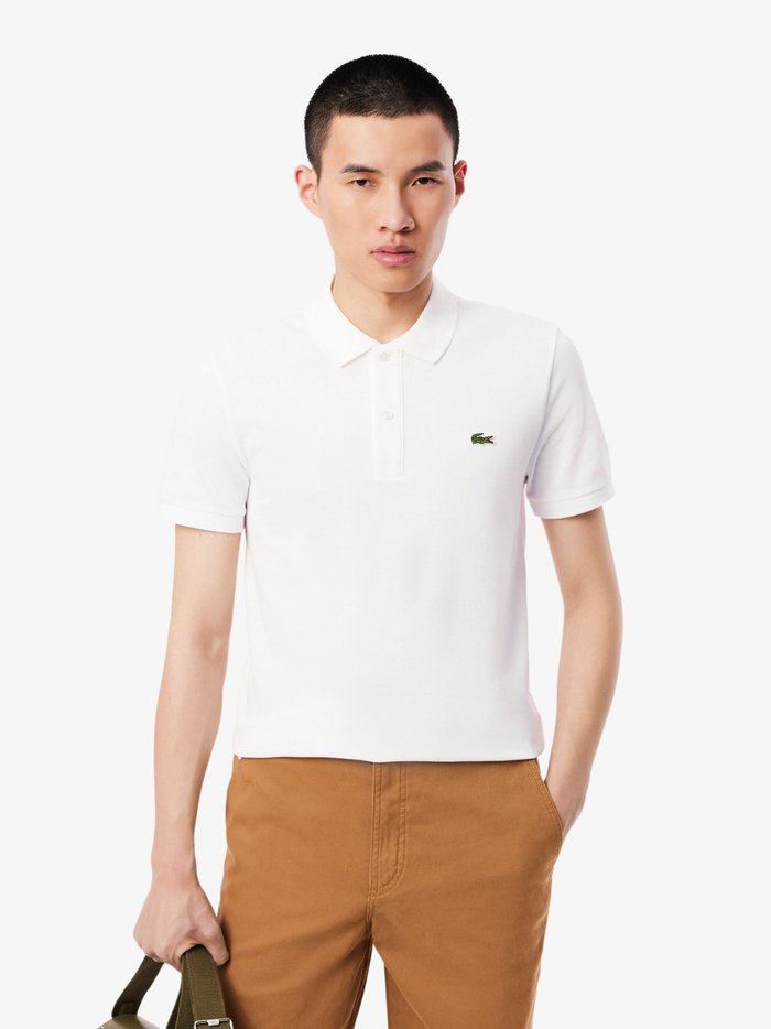 Back view of LACOSTE white slim fit polo shirt showing classic piqué cotton texture and tailored fit