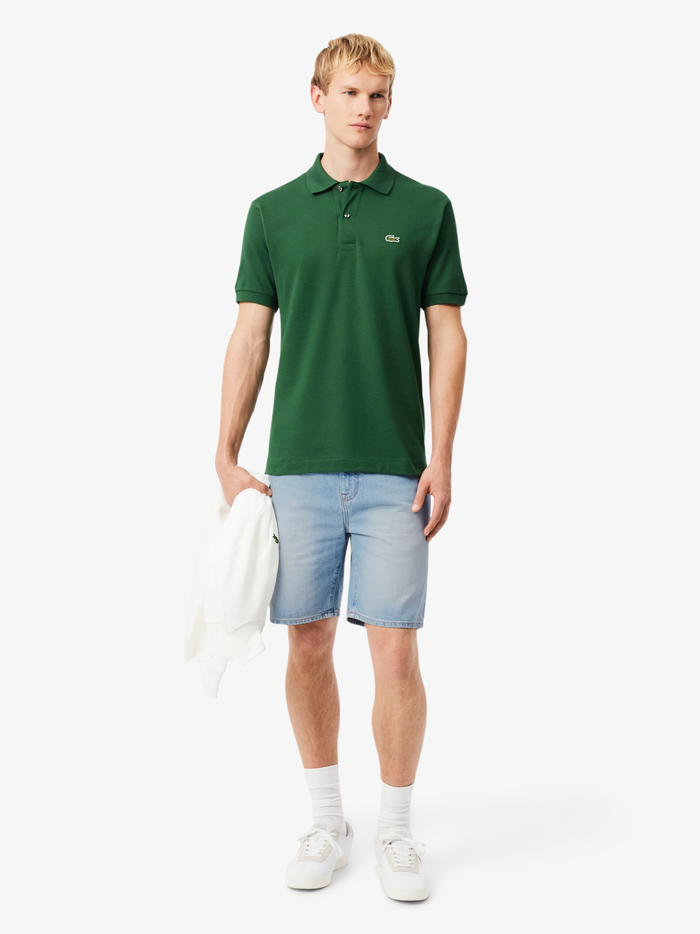 Back view of LACOSTE light blue denim Bermuda shorts showing leather Lacoste tab and green seam details
